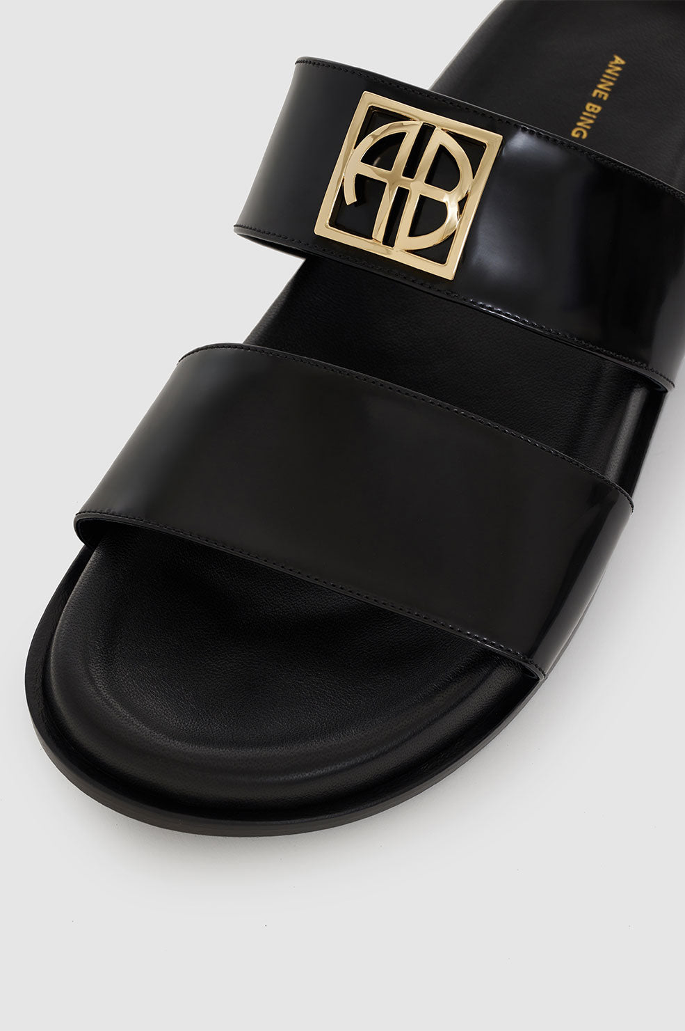 ANINE BING Parker Slides Monogram - High-Shine Black - Detail View